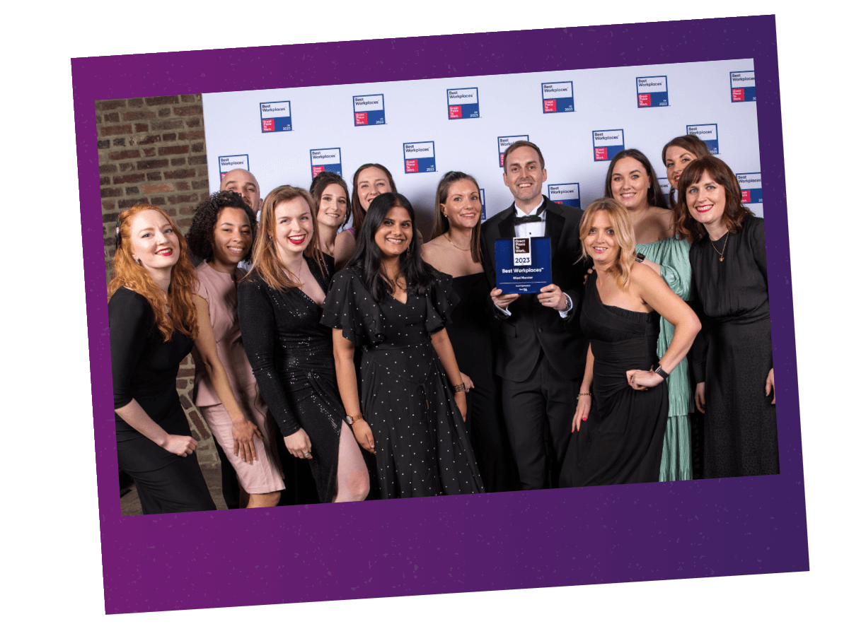 Group shot of the Word Monster team with Great Place to Work award.