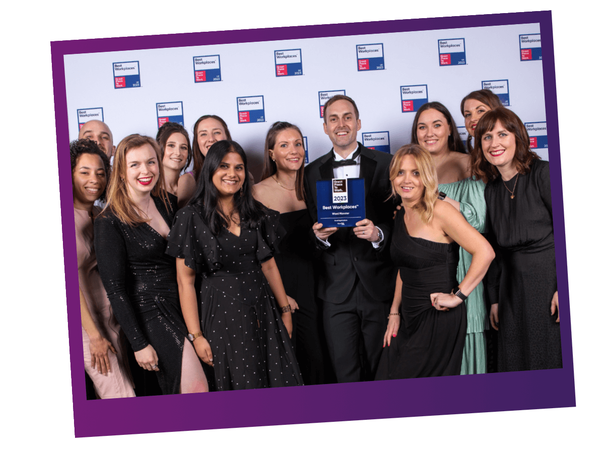 Group shot of the Word Monster team with Great Place to Work award.